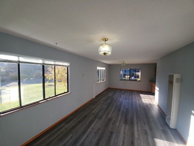 Building Photo - Spacious 1 bedroom with deck, wooded view & garden area. Most utilities included.