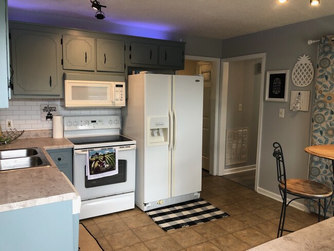 Kitchen includes washer/dryer in connected laundry room - 217 Waterford Dr