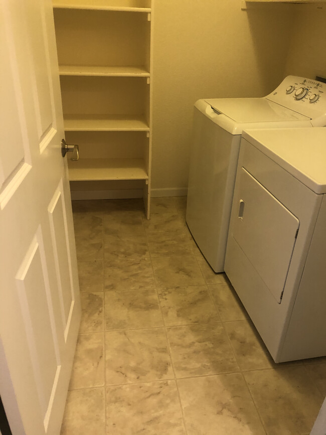 Laundry /storage room in unit - 9557 W San Juan Cir