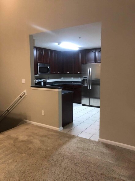 From upstairs entrance to kitchen - 13800 Herons Landing Way