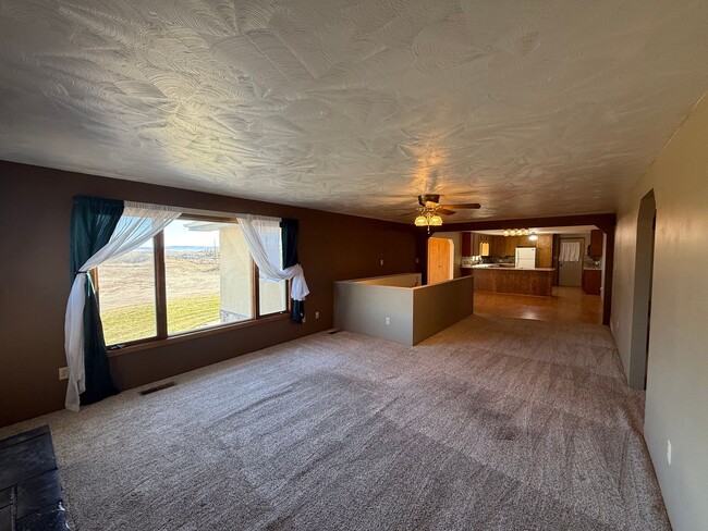 Building Photo - Spacious, four-bedroom, two-bathroom, coun...