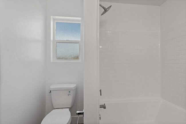 Building Photo - NEW HOME with large garage stalls and unfinished basement for additional storage