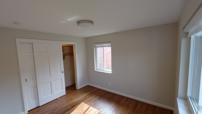 Bedroom 2 with extra large sliding door closet and designer fabric shades - 6934 Winding Way