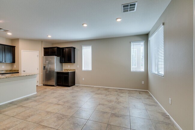 Building Photo - Spacious Townhouse with Loft & Rare 3-Car Garage!