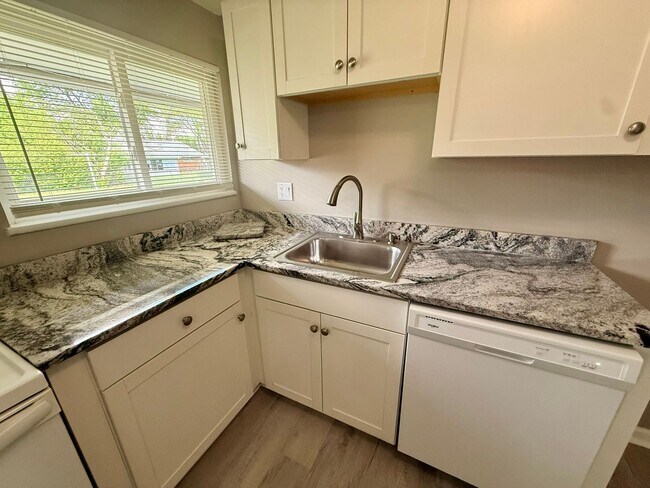 Building Photo - Move-In Ready 2BR with Stunning Granite + Fenced Backyard