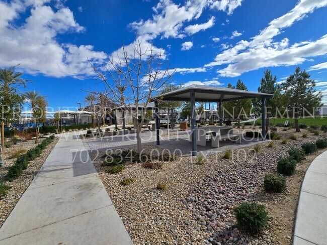 Building Photo - Gated~ 2 Bedroom Townhome w/2 Car Garage~MUST SEE!