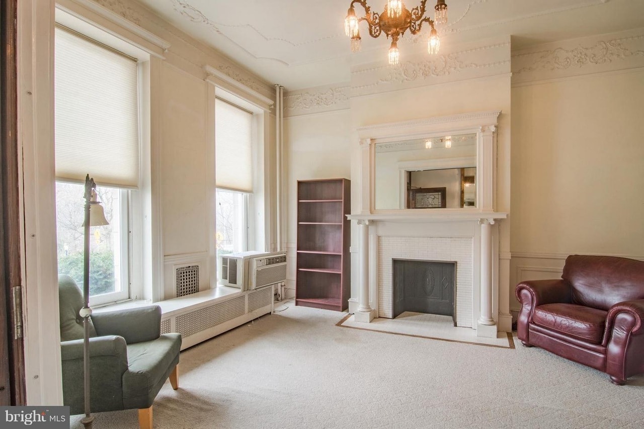 SUNNY ELEGANT LIVING ROOM AT FRONT OF HOME, GRACIOUS MANTLE AND ANTIQUE CHANDELIER - 2937 N Charles St