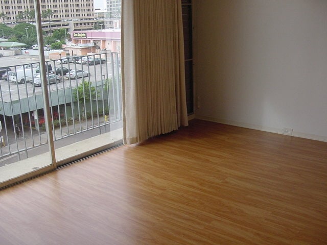 Building Photo - Holiday Manor studio, secured building, laminate wood flooring!