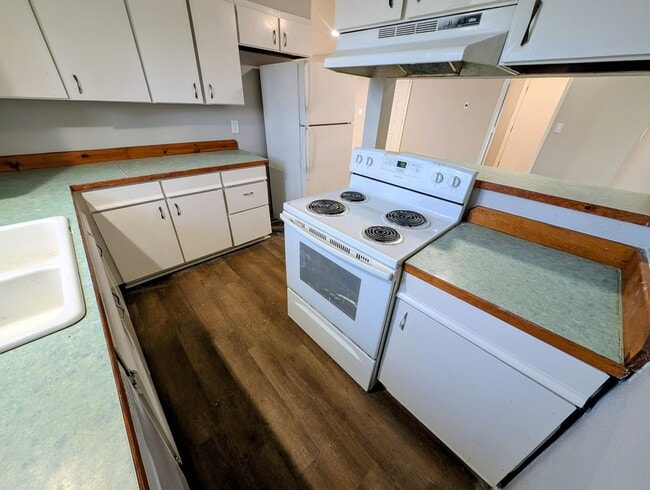 Building Photo - 4-bedroom house with a 2-car garage availa...