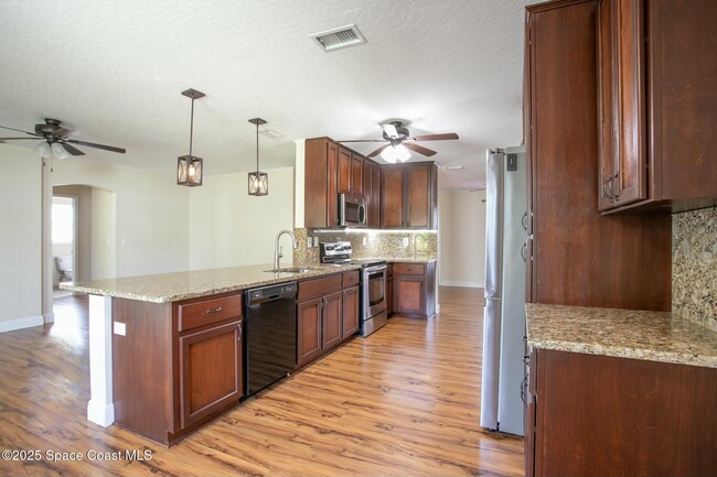 Building Photo - 6485 Orchid Ave