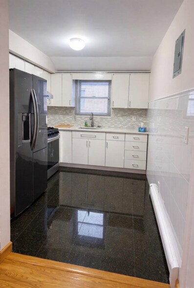 Building Photo - 214-27 38th Ave