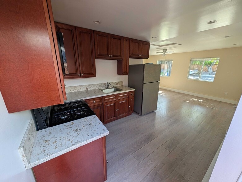 Kitchen open to living area with natural light - 6534 Peterson Ave