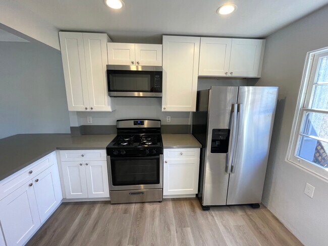 Kitchen cooking and refrigerator area - 4660 Dawes St