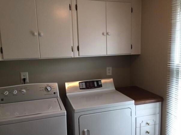 Large bright laundry room in-unit just off the kitchen. Loads of storage and space - hard to find in apartment homes! - 2325 Broadmeade Road