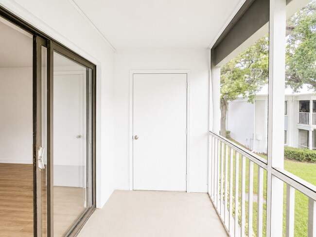 Building Photo - Updated 2-Bedroom Condo with Screened Lanai with water included.