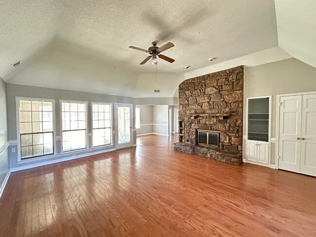 Building Photo - Grand 4BR/2BA Near Southwind | 2,438 Sq Ft, Stone Fireplace, Soaking Tub & 2-Car Garage