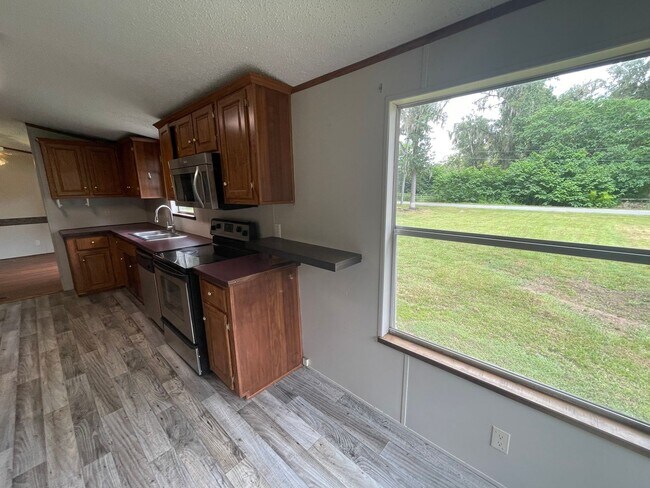 Building Photo - Looking for Acreage? This updated 3 bed, 2 bath home with an inside laundry room sits on 1.5 Acre...