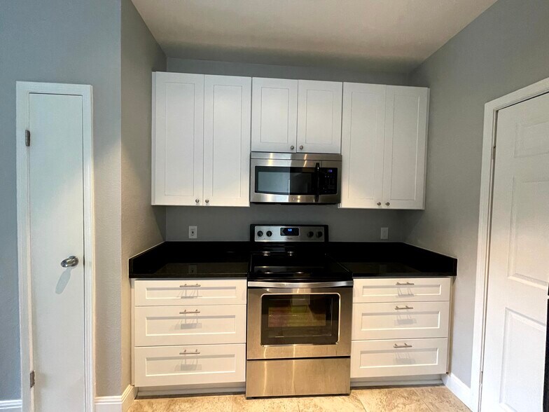 Kitchen with brand new counter tops and cabinets - 12166 Metric Blvd
