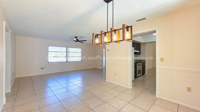 Building Photo - SPACIOUS SARASOTA HOME WITH LARGE FENCED YARD! MOVE IN READY! ALL TILE/ NEW LVP!