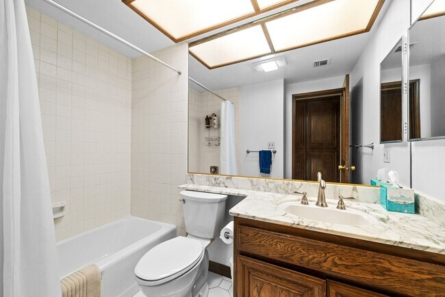 Building Photo - Elegant Corner Condo with Spacious Interiors