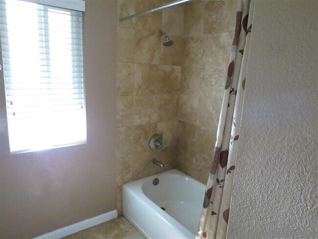 Building Photo - 7565 Charmant Dr