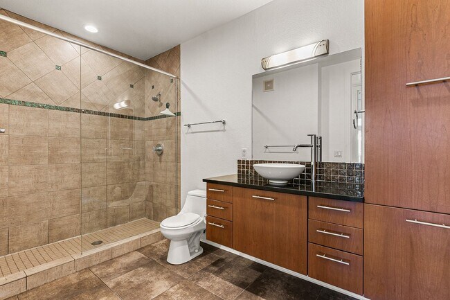 Building Photo - Fantastic Condo With Central AC And 1 Reserved Garage Parking Space!