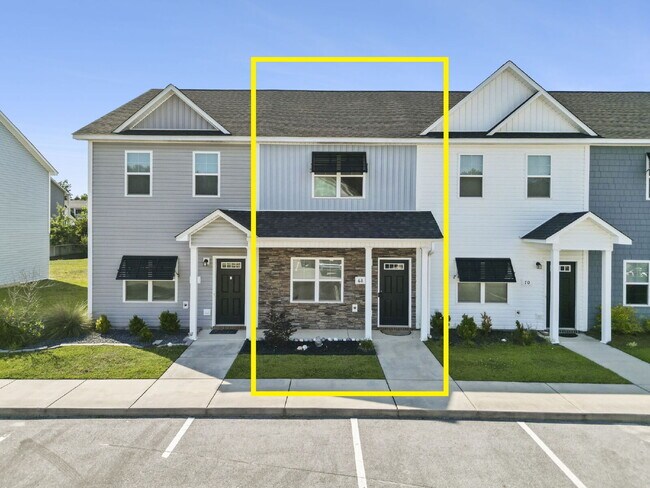 Building Photo - Available Now! Enjoy low-maintenance coastal living in this beautiful 2-bedroom, 2.5-bath townhom...