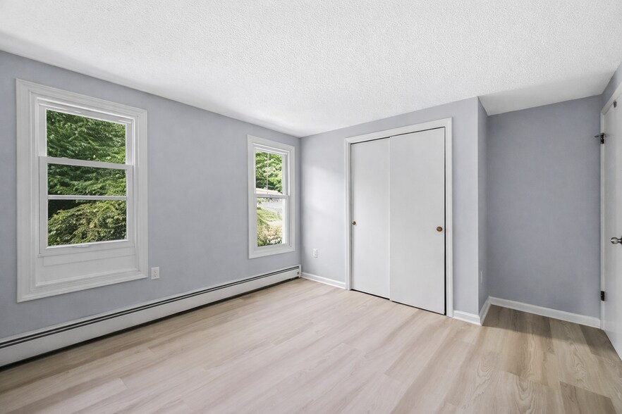 Bedroom 1 with large windows and comfortable layout - 16 Miller Rd