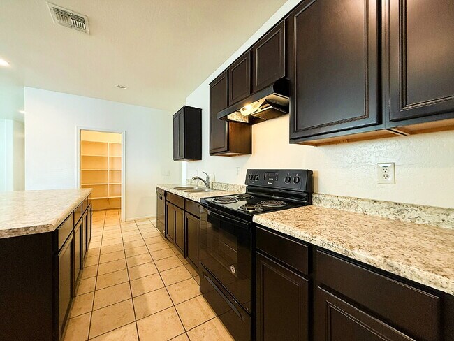 Building Photo - "Charming 3-Bedroom Oasis with 2 Baths & S...