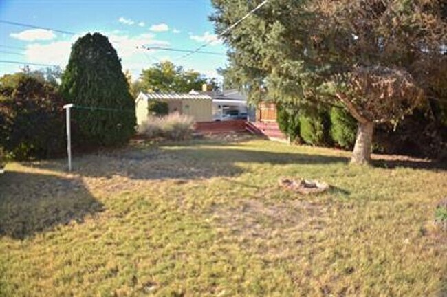Building Photo - Updated house with original hardwoods and 2-car garage!