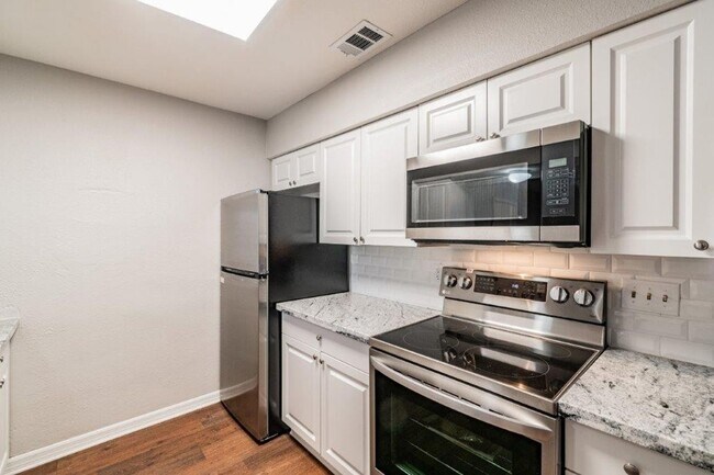 Building Photo - PRICE JUST REDUCED 3/2/1 1389 Sq. Ft. on a huge corner lot with granite & custom tile work!!