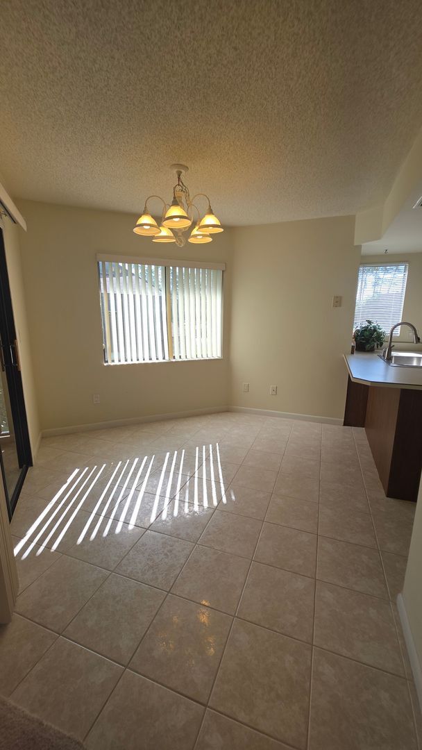 Building Photo - Beautiful Pond Front 2 Bedroom 2 Bath Townhome in the Wood Haven Community
