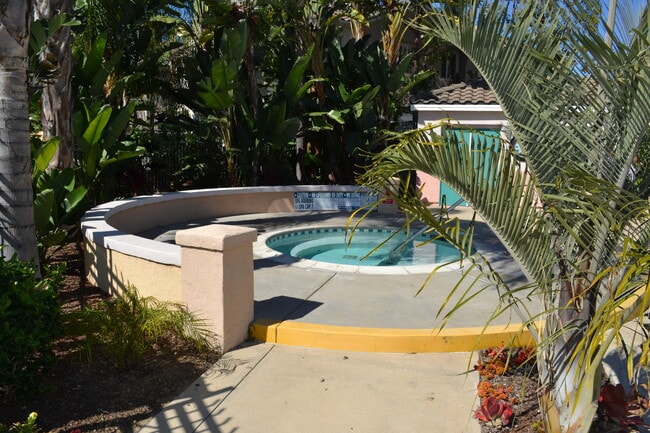 Building Photo - Spacious 3 Bedroom 2.5 Bath Townhouse with Private Garden Patio & a Community Pool/Spa! Attached ...
