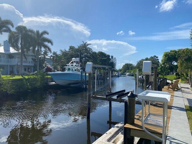 Building Photo - Palm City Home with Dock and Lift