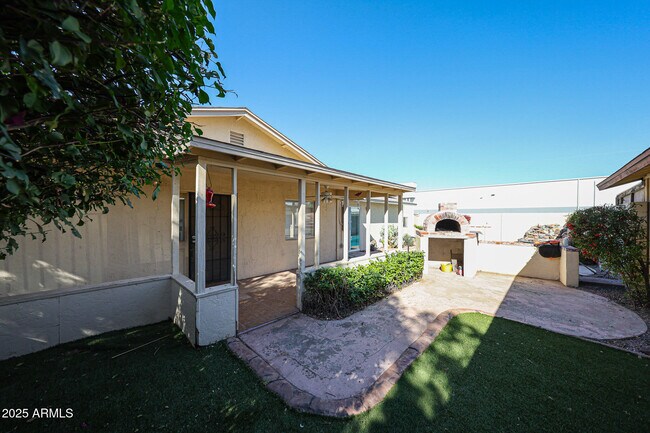 Building Photo - 3408 W Port Au Prince Ln