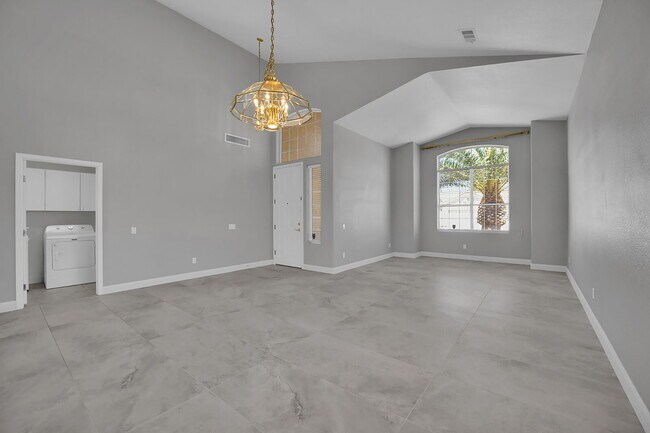 Building Photo - Spacious 4-bedroom, 3-car garage home feat...