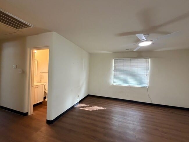 Building Photo - Tranquility inside. City adventures outside. Discover both in Downtown Cary!