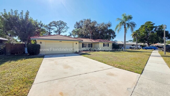Building Photo - SPACIOUS SARASOTA HOME WITH LARGE FENCED YARD! MOVE IN READY! ALL TILE/ NEW LVP!