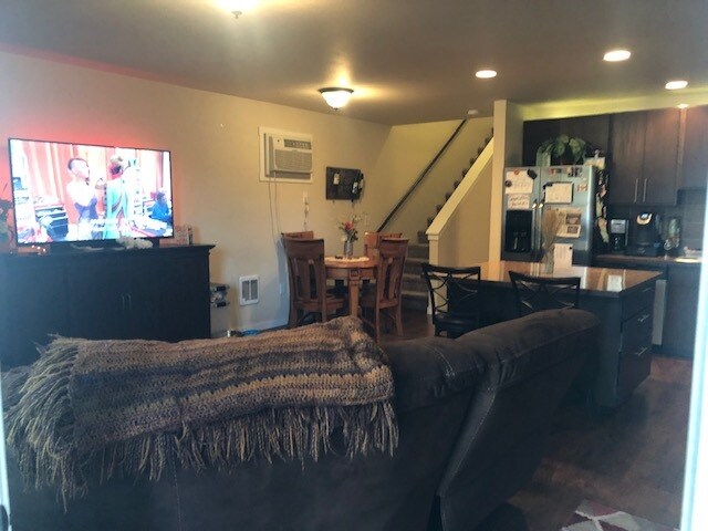 Family area shown with furniture. - 1220 W Bismark Ave
