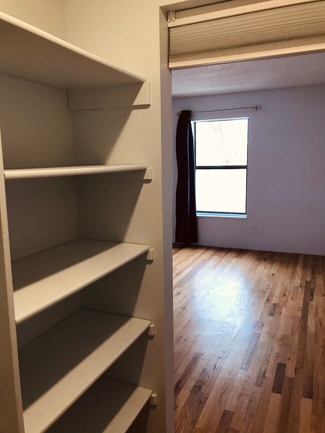 bedroom and closet - 7080 W 20th Ave