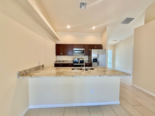 Building Photo - Like-New 3BR-2 Bath Duplex w/ Garage, Prime Cape Coral Location + Flexible Lease Options+Pet Frie...