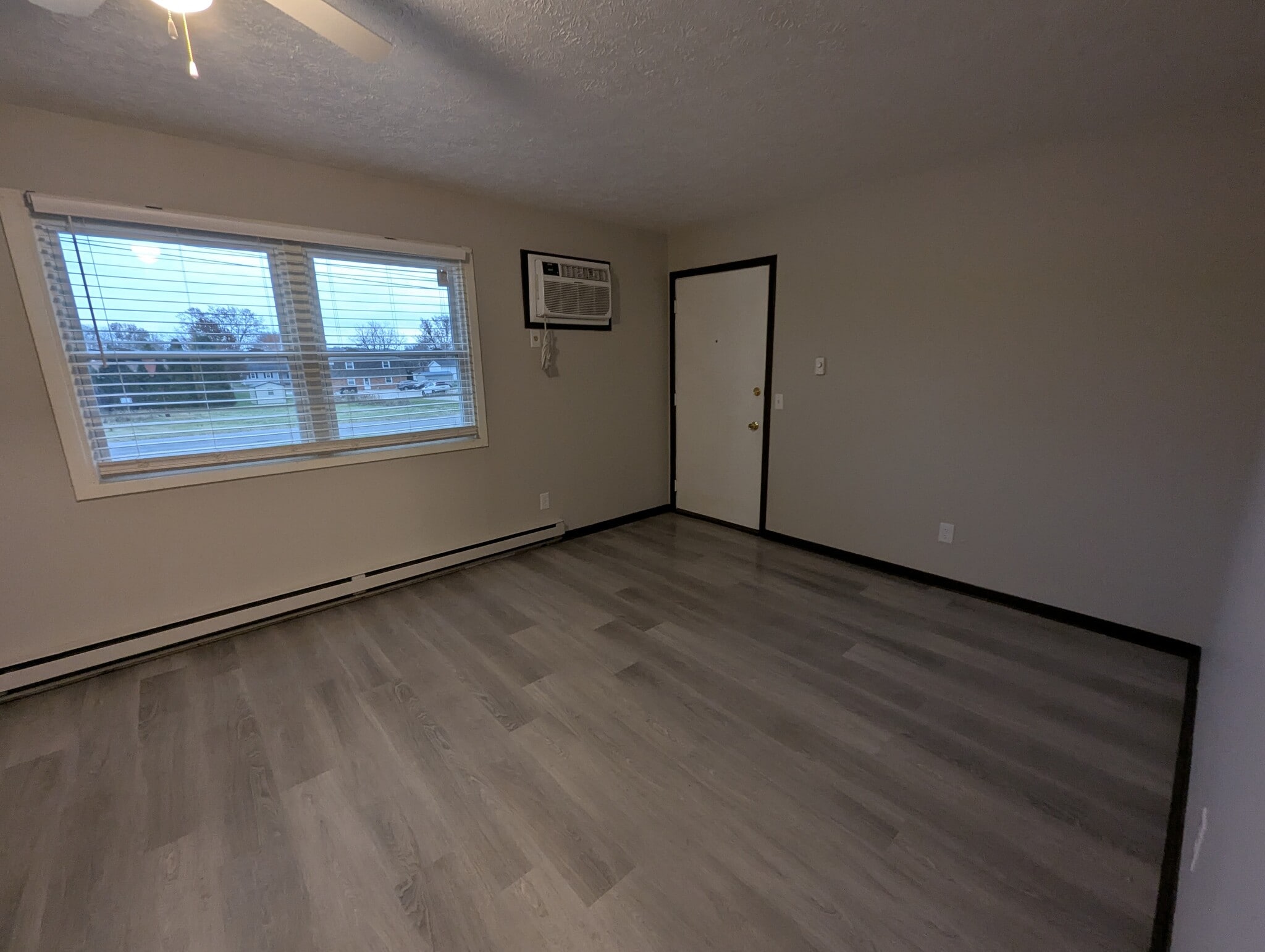 Living room new vinyl plank floor - 237 Summit St N