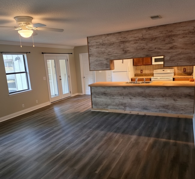 Building Photo - Corner Lot Charm: Spacious 4 Bed on Corner Lot w/ Custom Bookshelves & Private Storage Shed