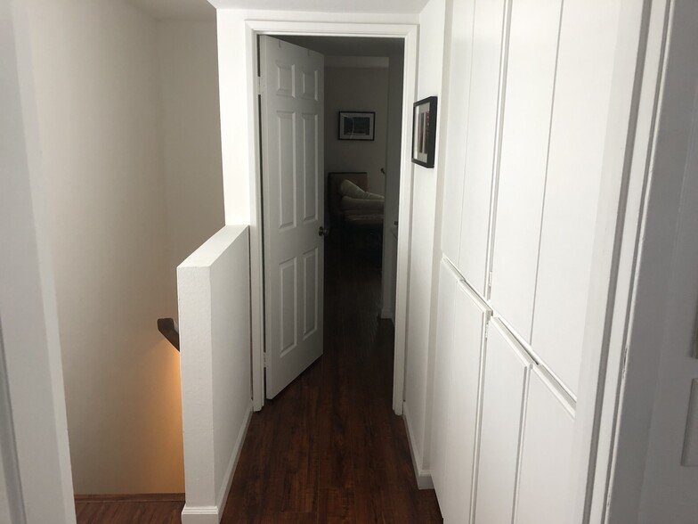 Upstairs hallway and linen closet (between both bdrms) - 12458 Weddington St