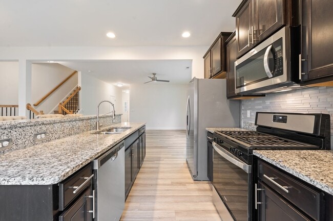 Building Photo - Stylish and Spacious 3 Bedroom, 2.5 Bathroom End-Unit Townhome w/ Garage! - ** SPECIAL OFFER: HAL...