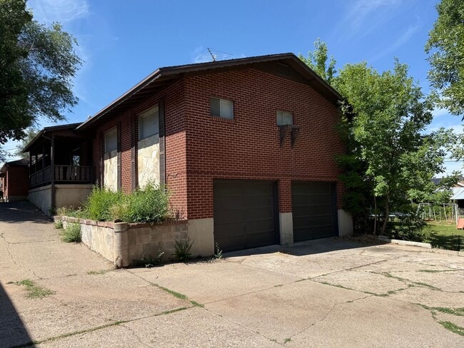 Building Photo - Beautiful town home with deep 2 car garage and a large covered patio