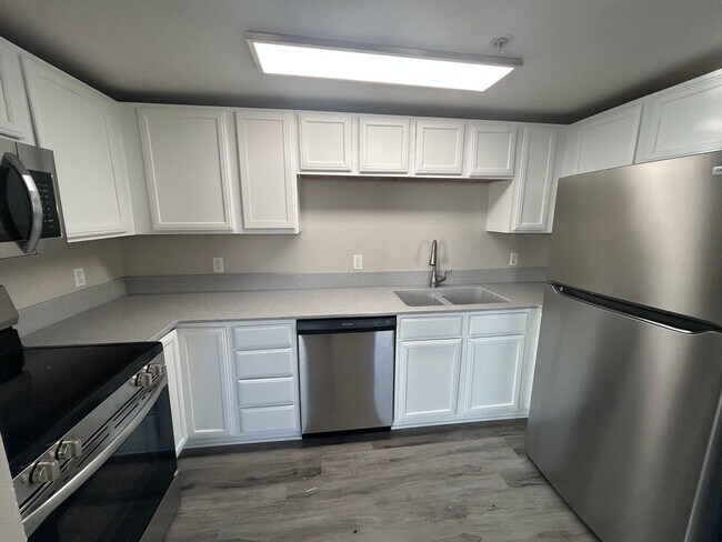 Building Photo - Solid surface countertops, stainless steel...