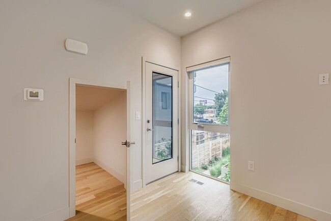 Building Photo - Swanky 1BR – New, Private Garage, Storage,...