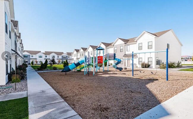 Building Photo - AWESOME END UNIT with attached 2 stall garage and additional personal parking spot on the exterior