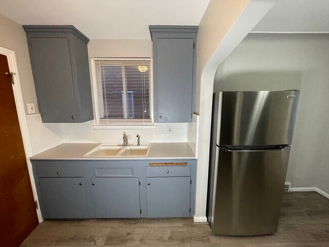 Kitchen refrigerator, cabinets, and sink - 20657 Kingsville St